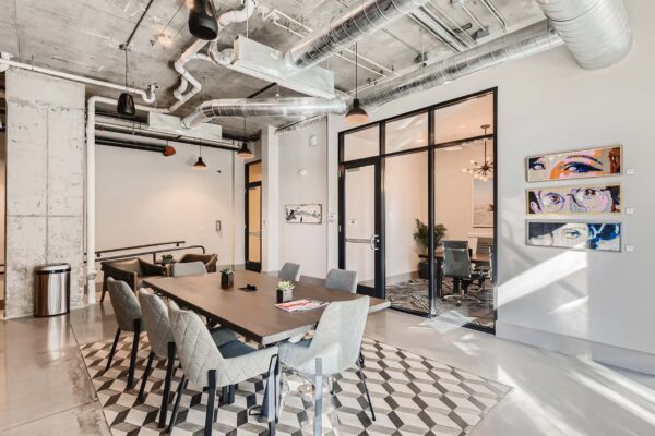 Arte St. Pete apartments business center with offices and conference tables.