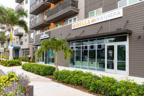 Arte St. Pete apartments building and adjacent businesses.