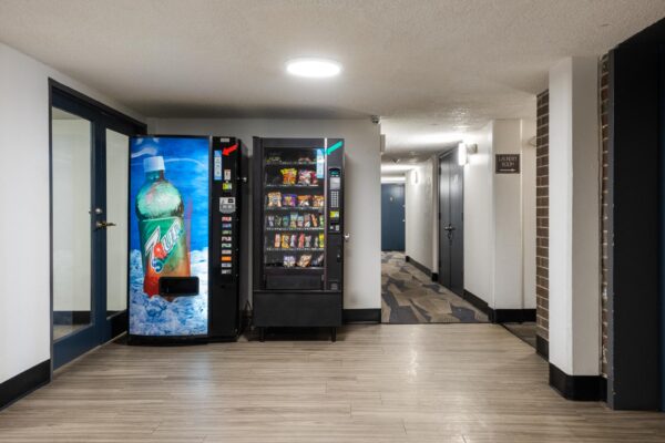 Beacon House apartments hallway with drink and snack vending machines.