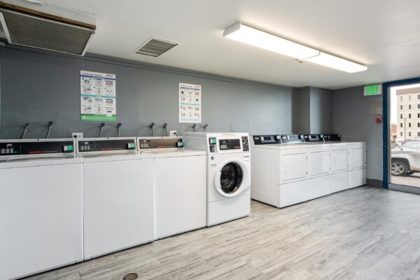 Beacon House apartments laundry room with washers and dryers.