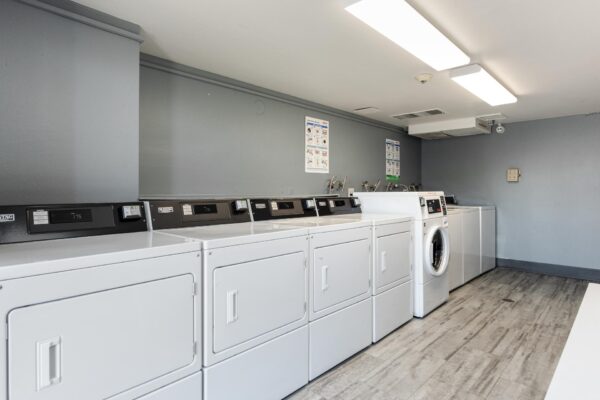 Beacon House apartments laundry room with washers and dryers.