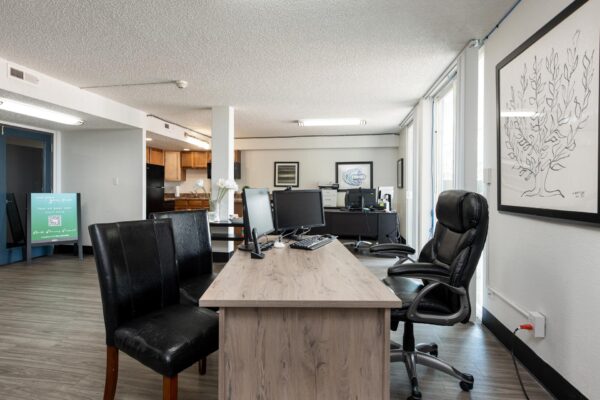 Beacon House apartments leasing office with reception area and desks.