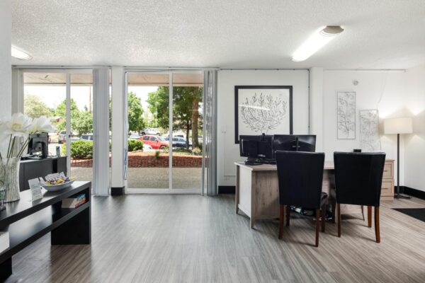 Beacon House apartments leasing office with reception area and desks.