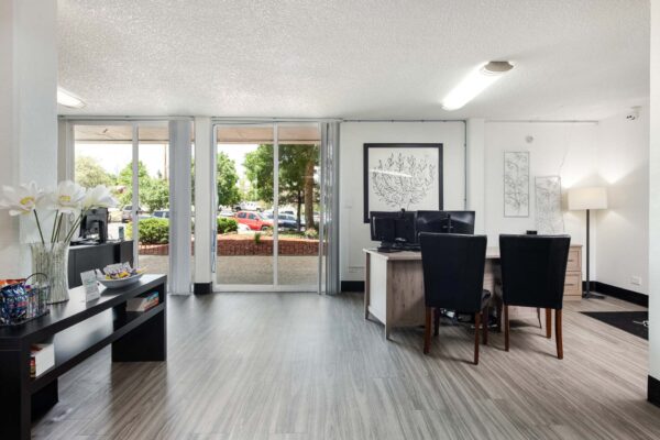 Beacon House apartments leasing office with reception area and desks.