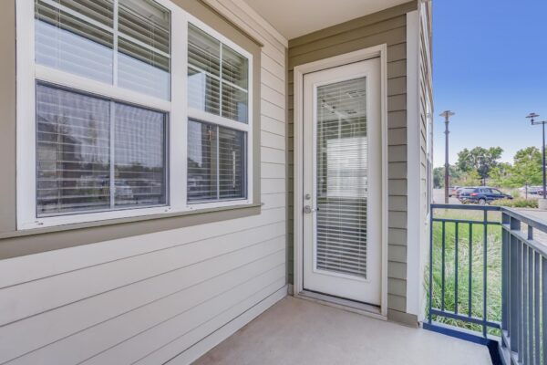 Centre Court apartment balcony with metal railing.