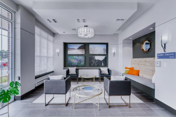 Centre Court apartments lobby with elegant seating, large windows, and artwork.