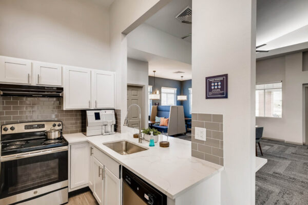 Copper Ridge apartments community kitchen with coffee machine and stainless steel appliances.