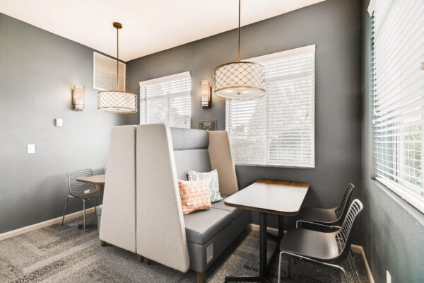 Copper Ridge apartments clubroom with cozy booths.