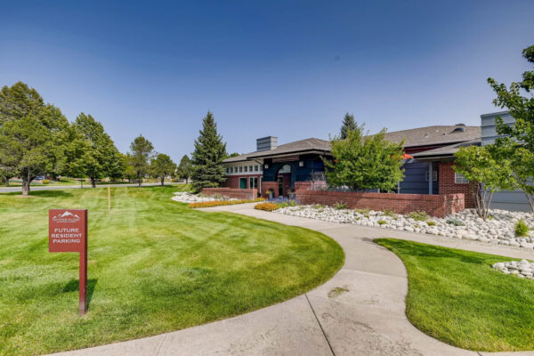 Copper Ridge apartments exterior with lush landscaping and paved walkways.