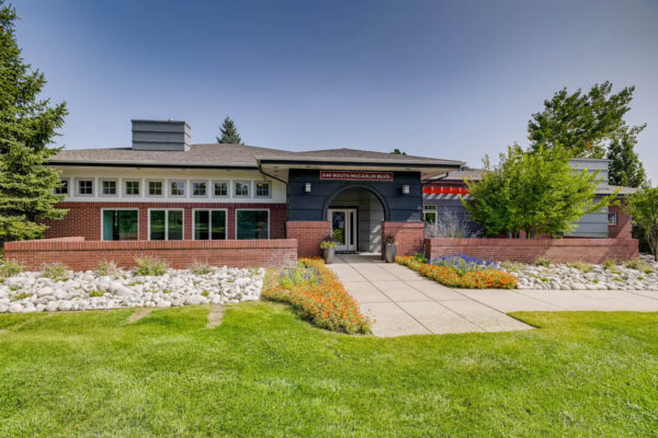 Copper Ridge apartments with lush landscaping and paved walkways.