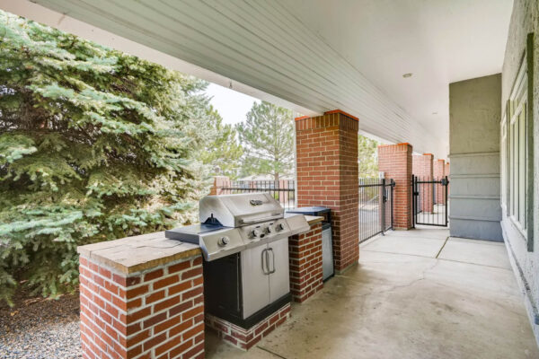Copper Ridge apartments outdoor lounge with BBQ grill.