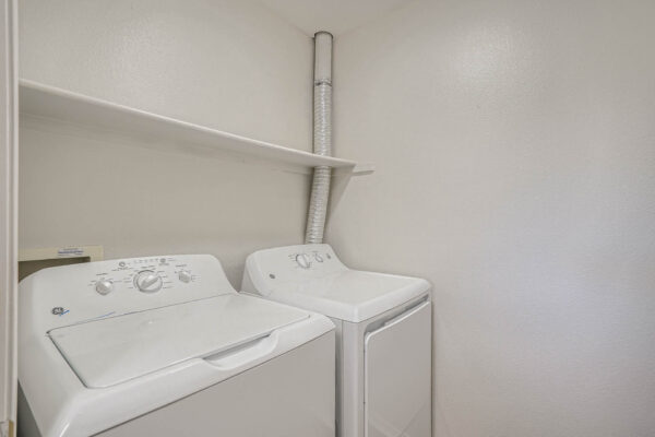 Copper Ridge apartment laundry room with washer and dryer.