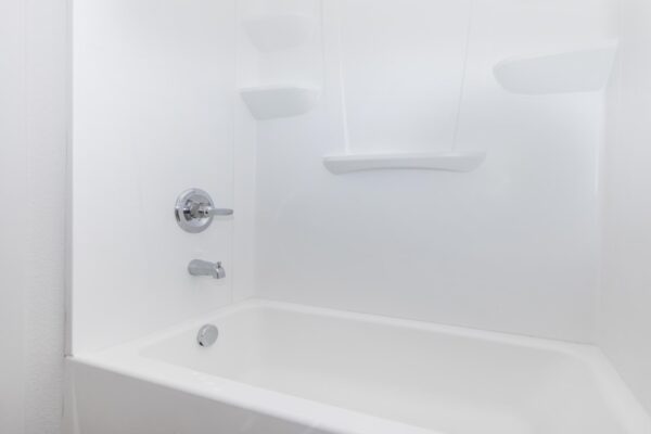 Cottages at Jet Wing apartment bathroom with white shower tub.