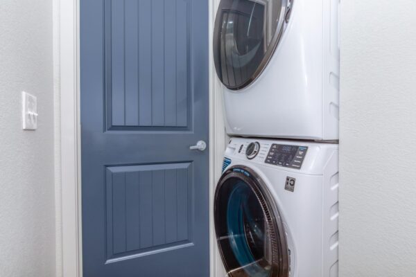 Cottages at Torin Point apartment laundry closet with stacked washer dryer.