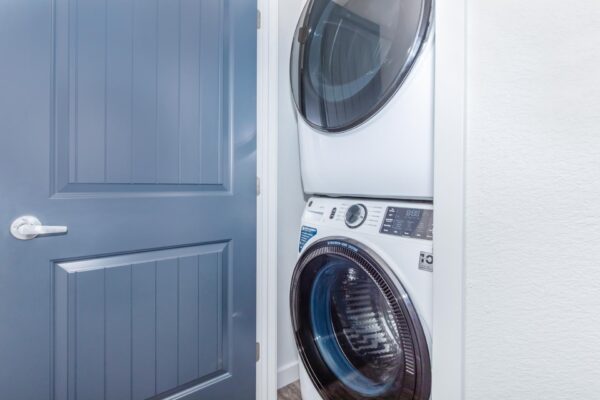 Cottages at Torin Point apartment laundry closet with stacked washer dryer.