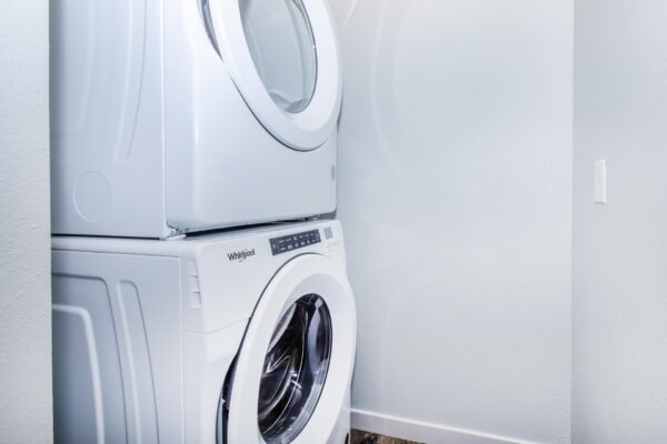 Cottages at Torin Point apartment laundry closet with stacked washer dryer.