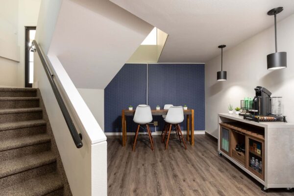 Flats at Pinecliff apartments coffee bar with dining table.