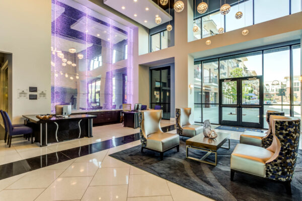 Forum Fitzsimons apartments lobby with plush seating and leasing office.