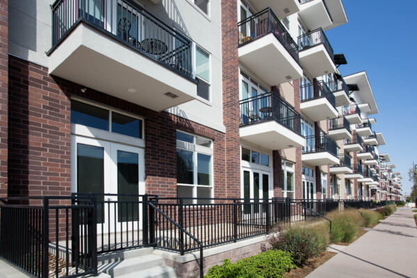 Forum Fitzsimons apartments with modern brick construction and large balconies.