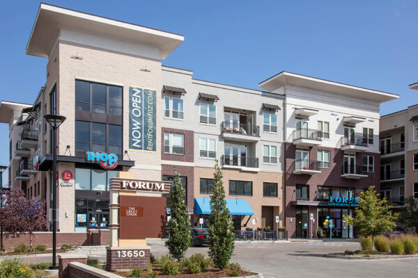 Forum Fitzsimons apartments with ample parking and retail spaces.