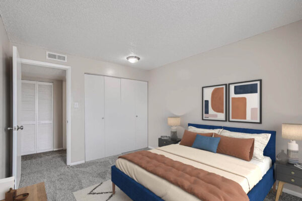 Heights on Huron apartments with plush carpet, bed with headboard, wood style closet doors.