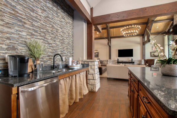 Highlands Lodge apartments community coffee bar with wood style floors and cabinets and coffee machine.