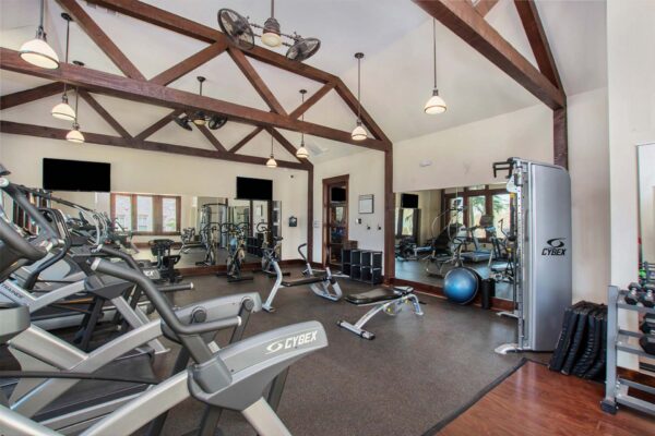 Highlands Lodge apartments fitness center with cardio machines and weight equipment.