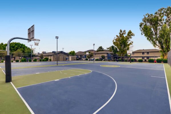 Latitude apartments sports area with lighted basketball courts.