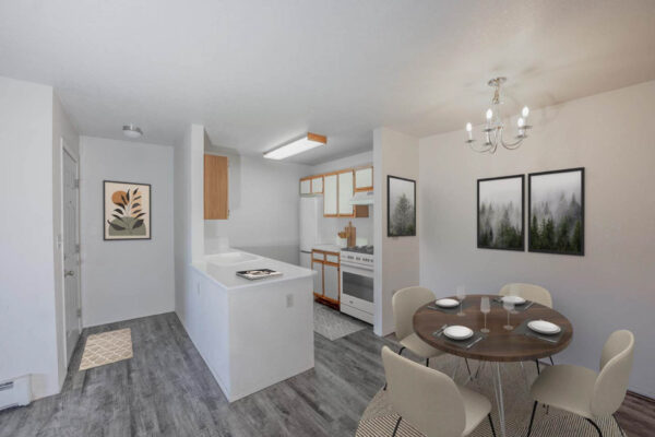 Mountain Village apartments dining area with wood flooring, light fixtures and modern kitchen.