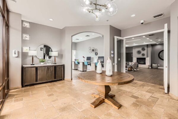 Pavilions at Arrowhead apartments lobby with elegant decor and tile floor.