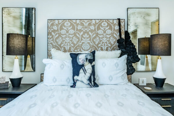 Residence at Old Hickory Lake apartments bedroom with dark style nightstands, and abstract artwork.