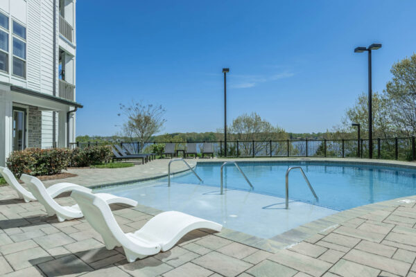 Residence at Old Hickory Lake apartments saltwater swimming pool with lounge seating.