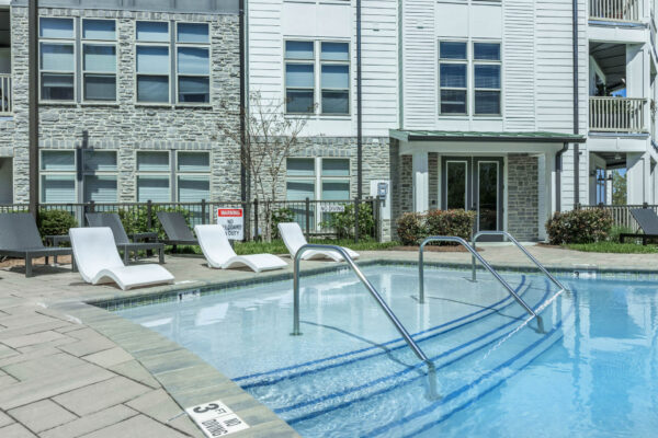 Residence at Old Hickory Lake apartments saltwater swimming pool with lounge seating.