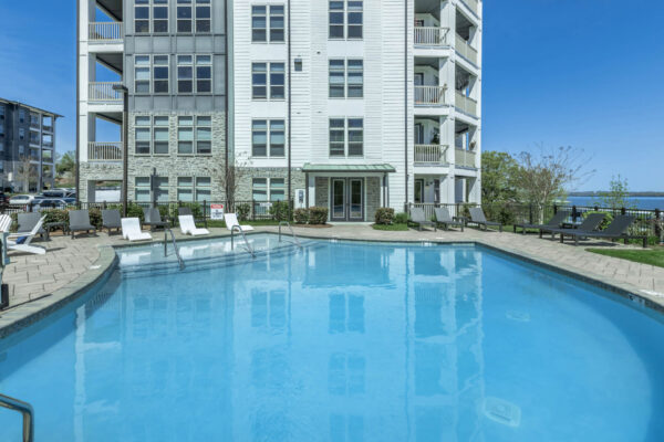 Residence at Old Hickory Lake apartments saltwater swimming pool with lounge seating.