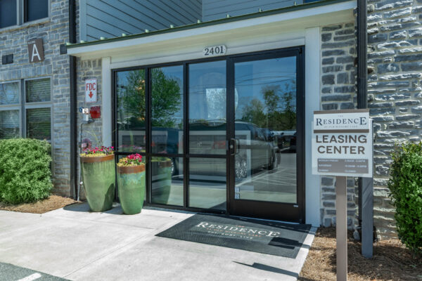 Residence at Old Hickory Lake apartments leasing center entry way with large glass doors.