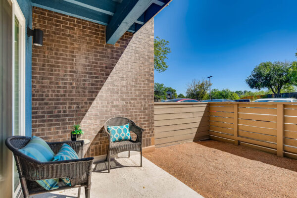 Sky at Bear Creek apartments patio/balcony with outdoor light and chairs