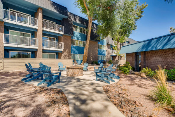 Sky at Bear Creek apartments firepit with lawn chairs in view of apartment balconies