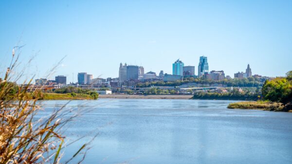 Kansas City Skyline over river with trees