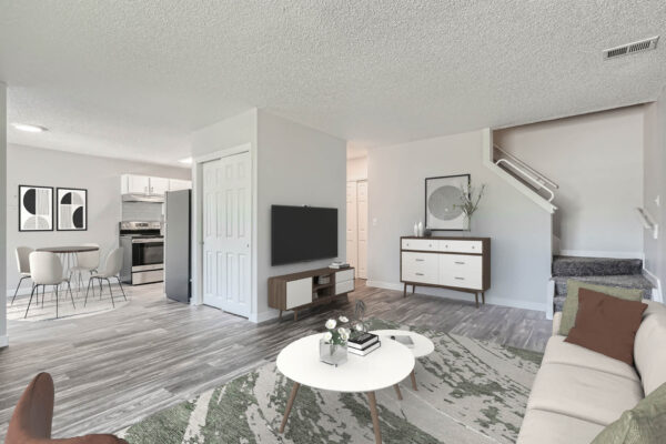 Sunset Peak apartments living room with gray wood like flooring and white walls