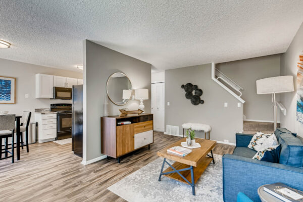 Sunset Peak apartments living room with wood like flooring and taupe walls