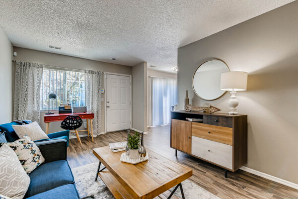 Sunset Peak apartments living room with wood like flooring and taupe walls