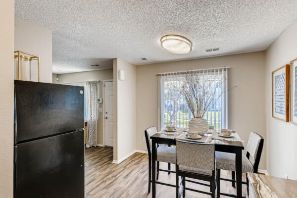 Sunset Peak apartments dining room with sliding glass door