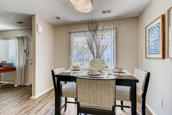 Sunset Peak apartments dining room with sliding glass door