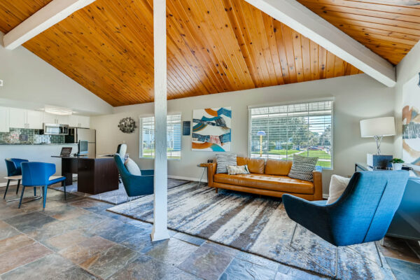 Sunset Peak apartments community space with gray tile flooring and lounge seating