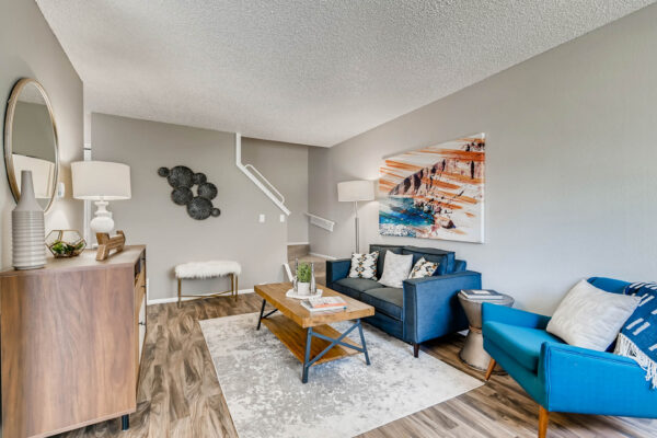 Sunset Peak apartments living room with wood like flooring and taupe walls