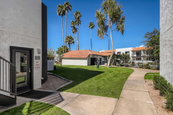 Tempe Vista apartments with classic architecture and lush green lawns.
