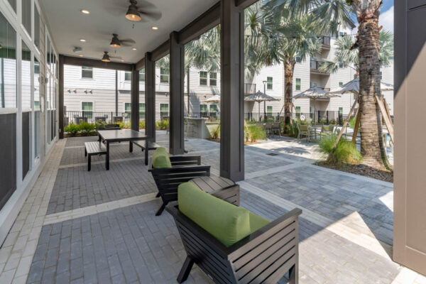 The Avery apartments outdoor lounge with dining table and chairs.