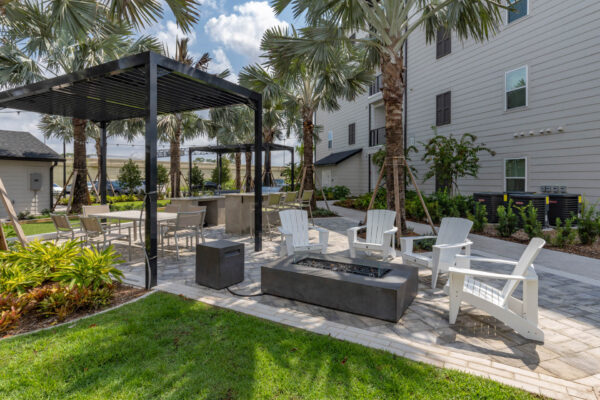 The Avery apartments outdoor lounge with chairs and fire pit.