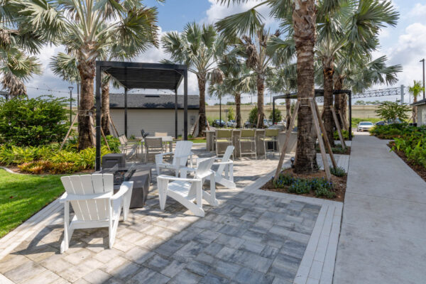 The Avery apartments outdoor lounge with chairs and fire pit.