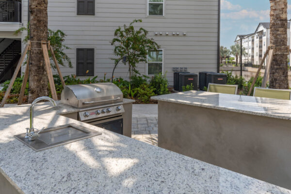 The Avery apartments outdoor lounge with BBQ grill.